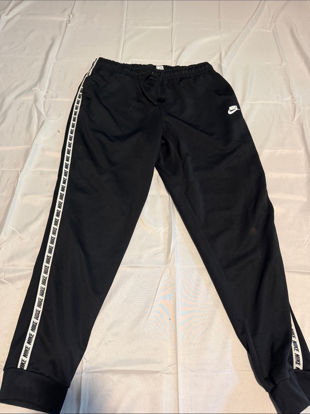 Nike Black Jogger Pants with White Logo & Side Stripe